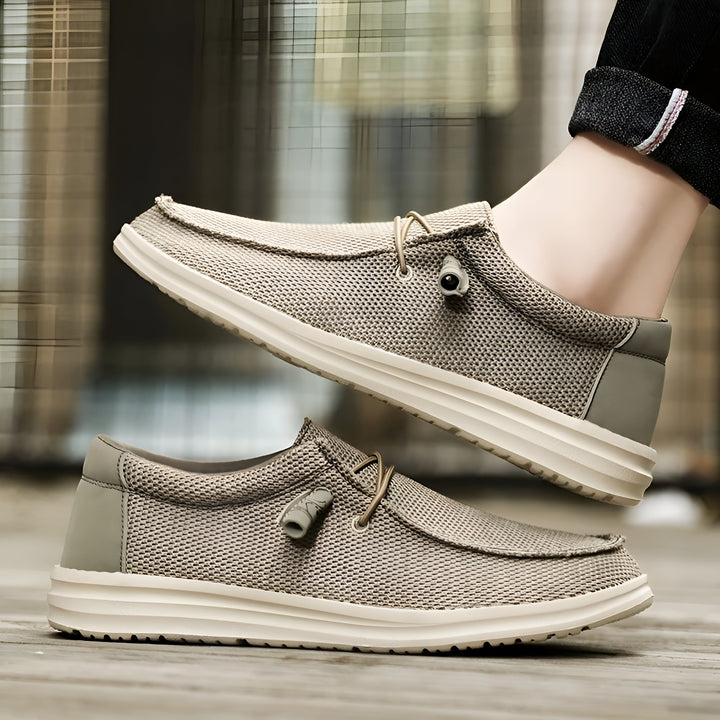 Chaussures décontractées beiges en maille, mocassins légers avec semelle blanche. Idéales pour un look relax. Un pied est en partie visible, portant un jean à revers., 45286668370101,45286668402869,45286668435637,45286668468405,45286668501173,45286668533941,45286668566709,45286668599477,45286668632245,45286668665013,45286668697781,45286668730549,45286668763317,45286668796085,45286668828853,45286668861621,45286668894389,45286668927157,45286668959925,45286668992693,45286669025461,45286669058229,4528666